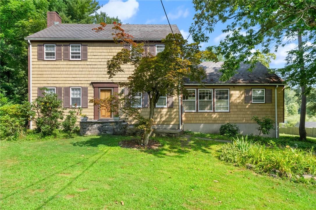 Colonial house with a front lawn