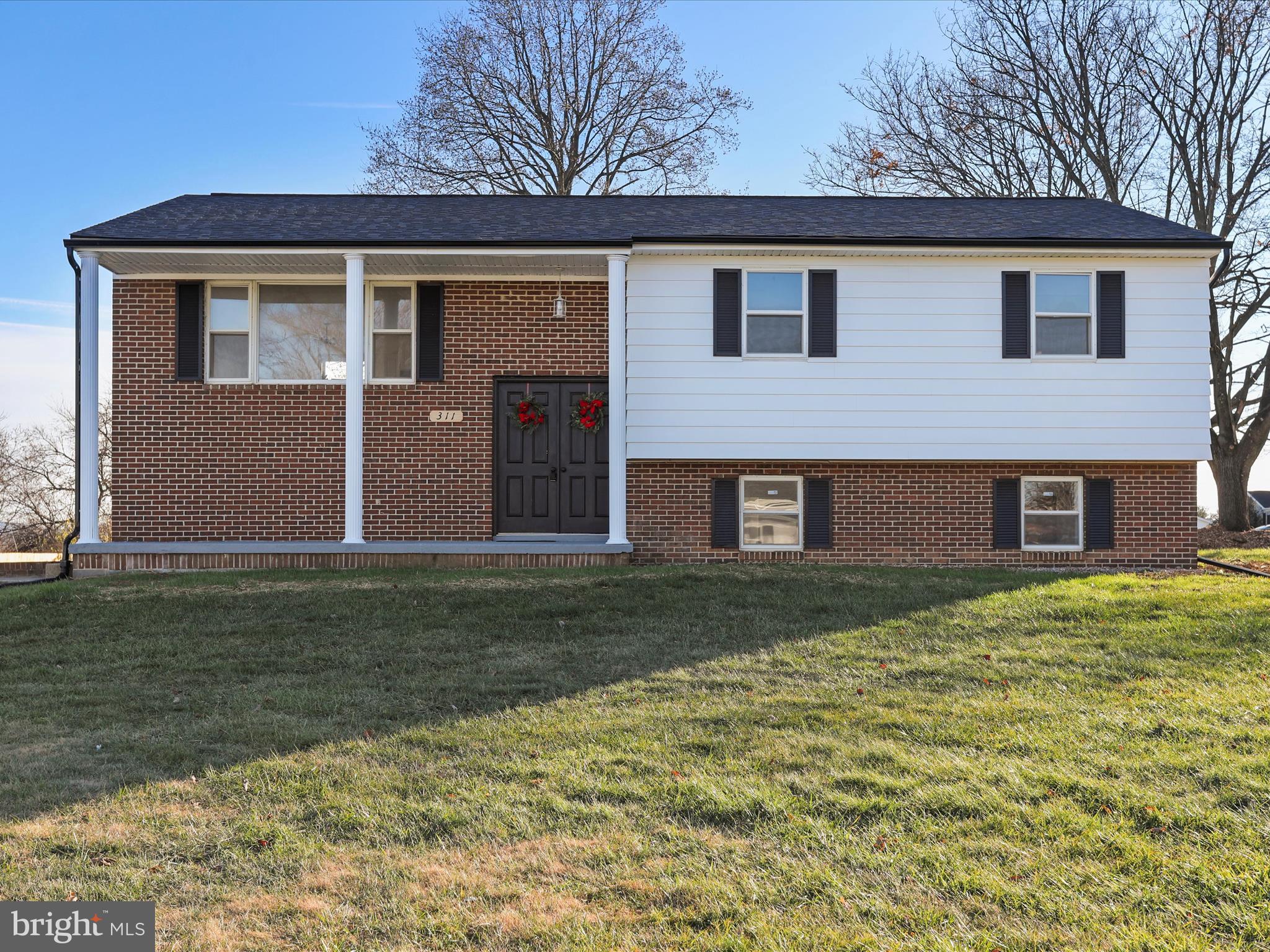 a front view of house with yard