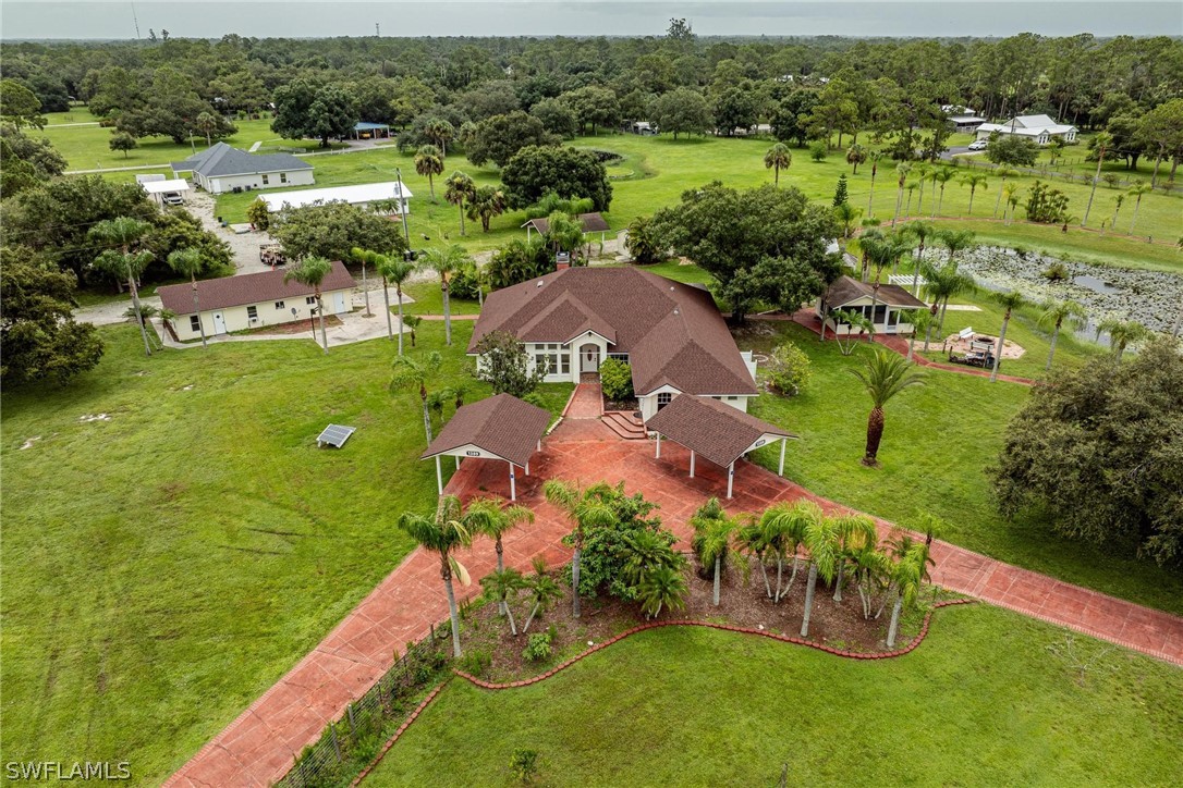 an aerial view of a houses with outdoor space and street view