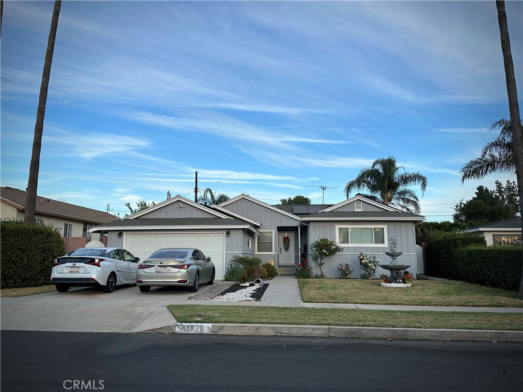 a view of a car parked in front of a house