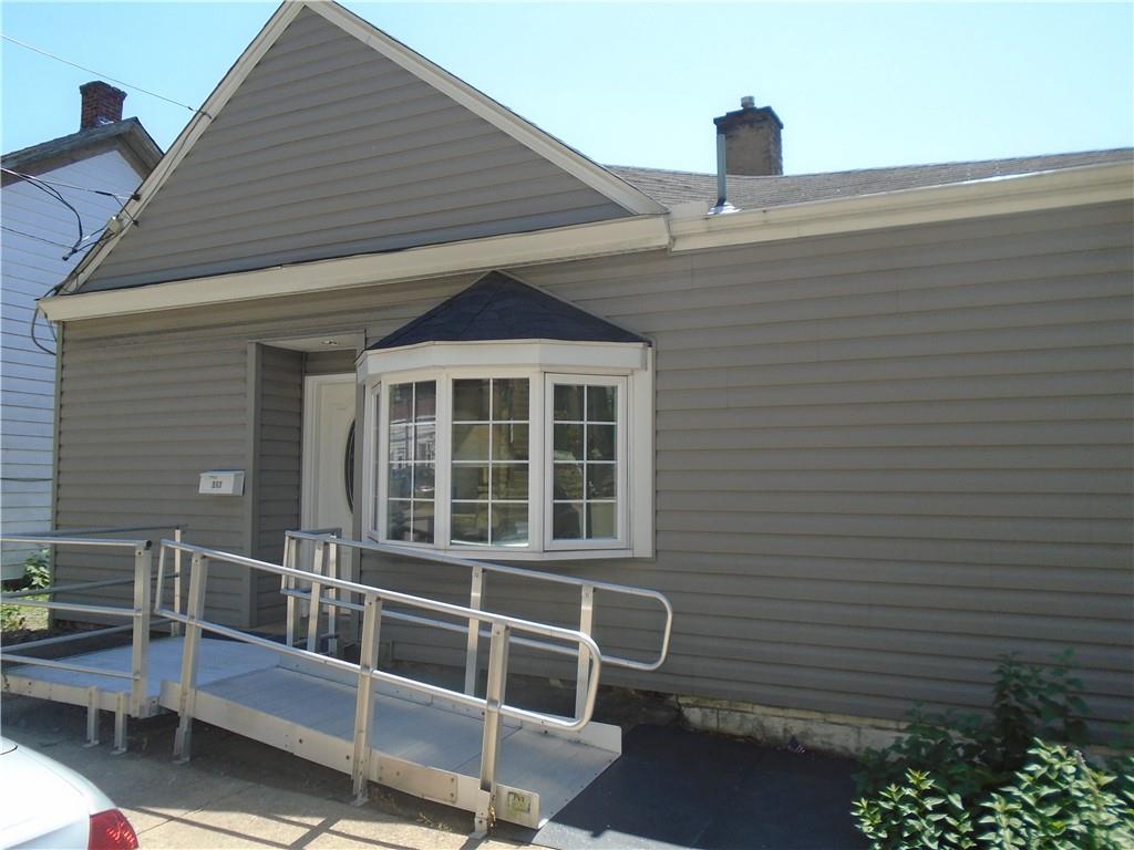 a front view of a house with a garage