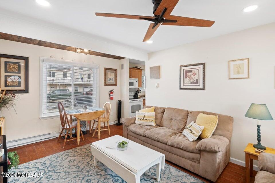 a living room with furniture a table and a potted plant