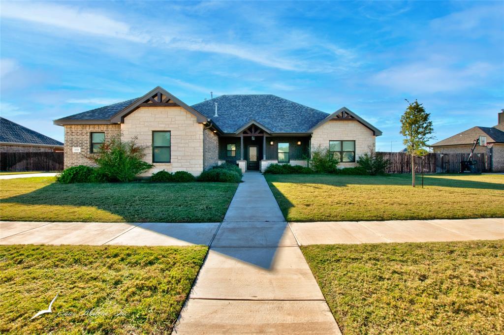 front view of a house with a yard