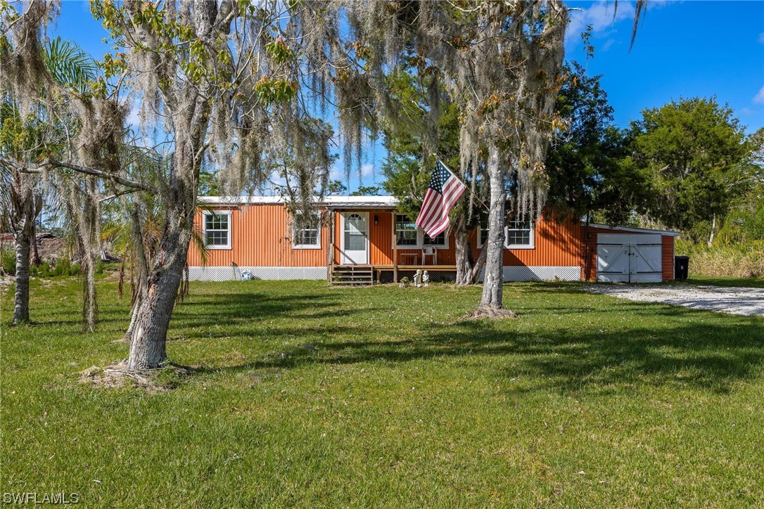 a view of a house with a yard