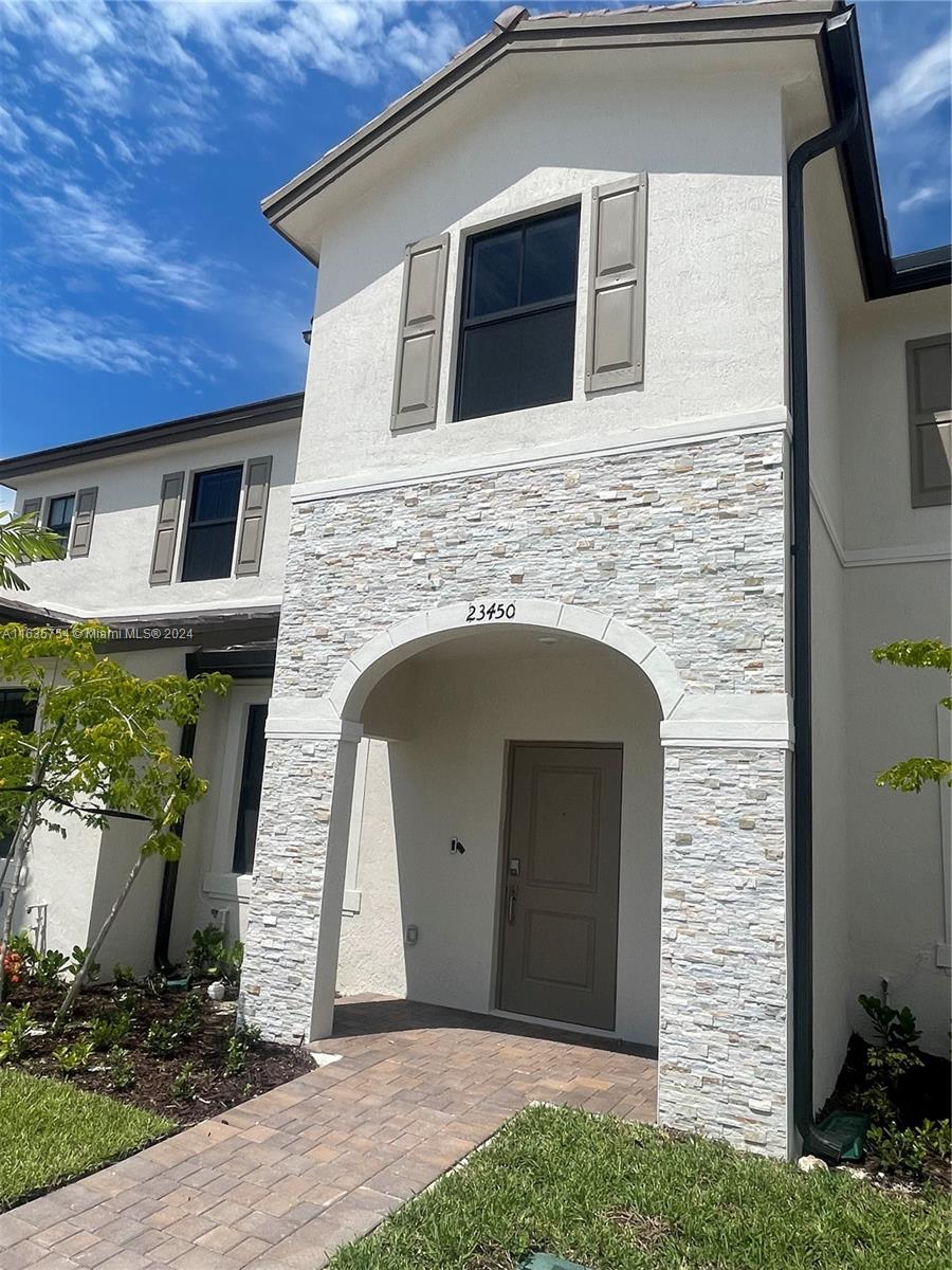 a front view of a house with garage