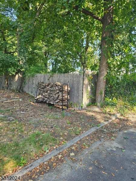 a view of a yard with a tree