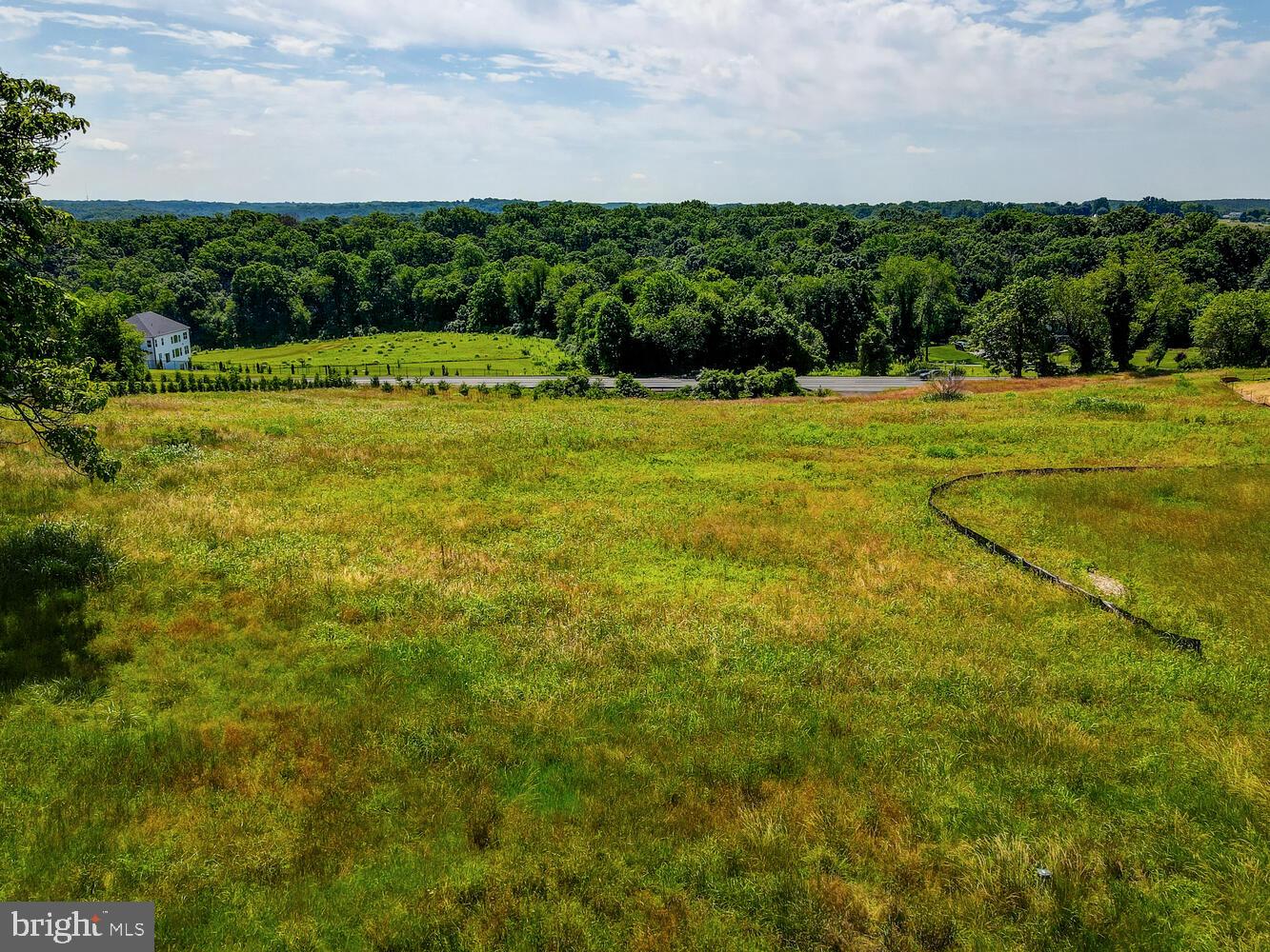 a view of a green field with clear sky