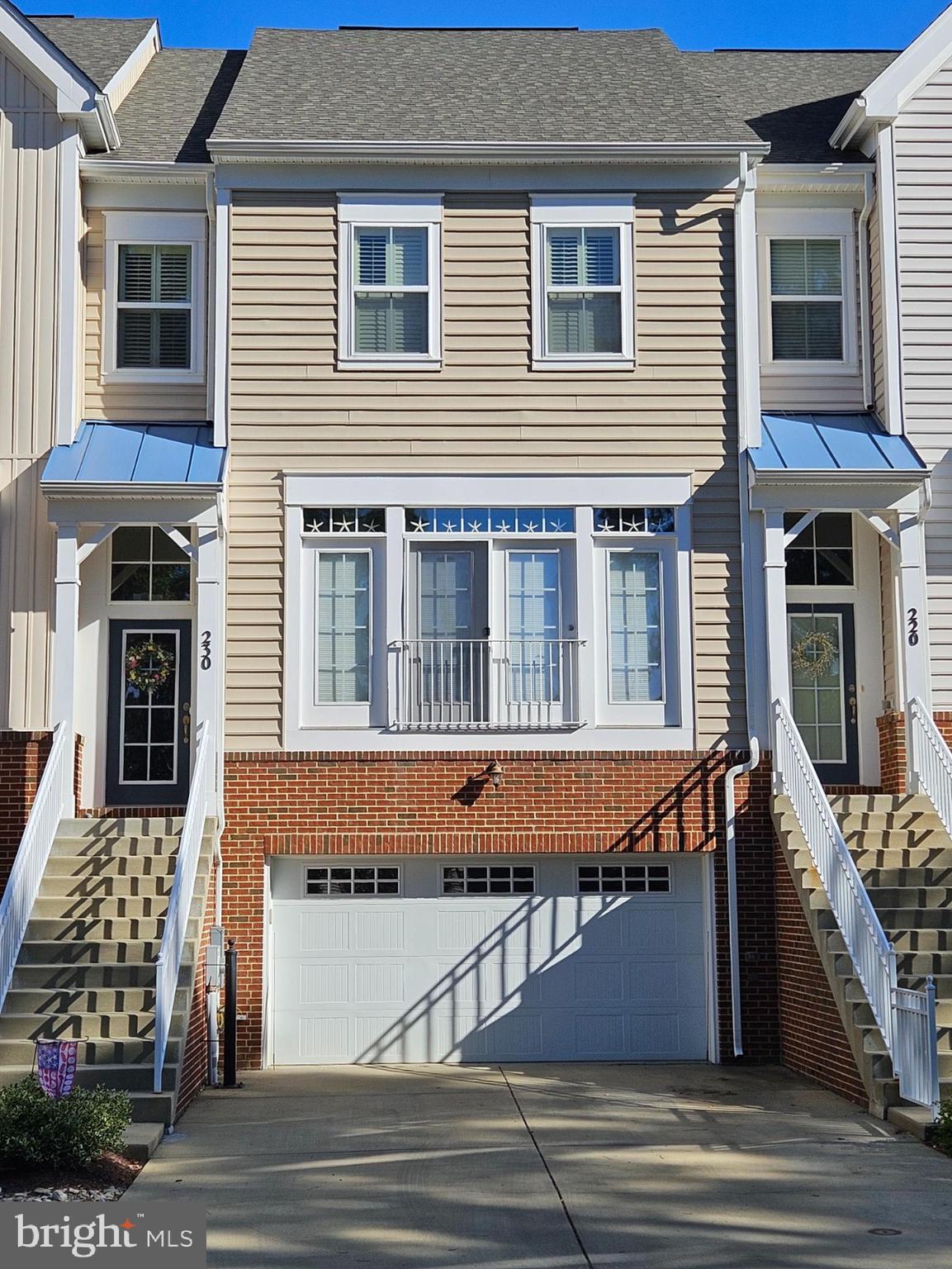 a front view of a house with a garage