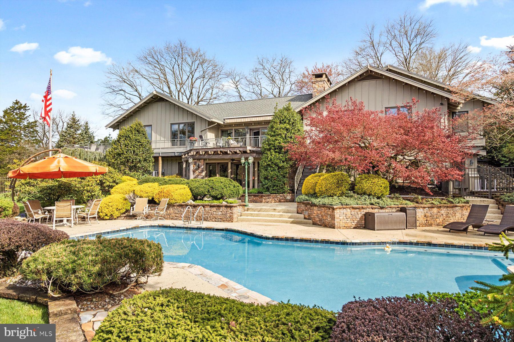 a view of a house with a yard and sitting area