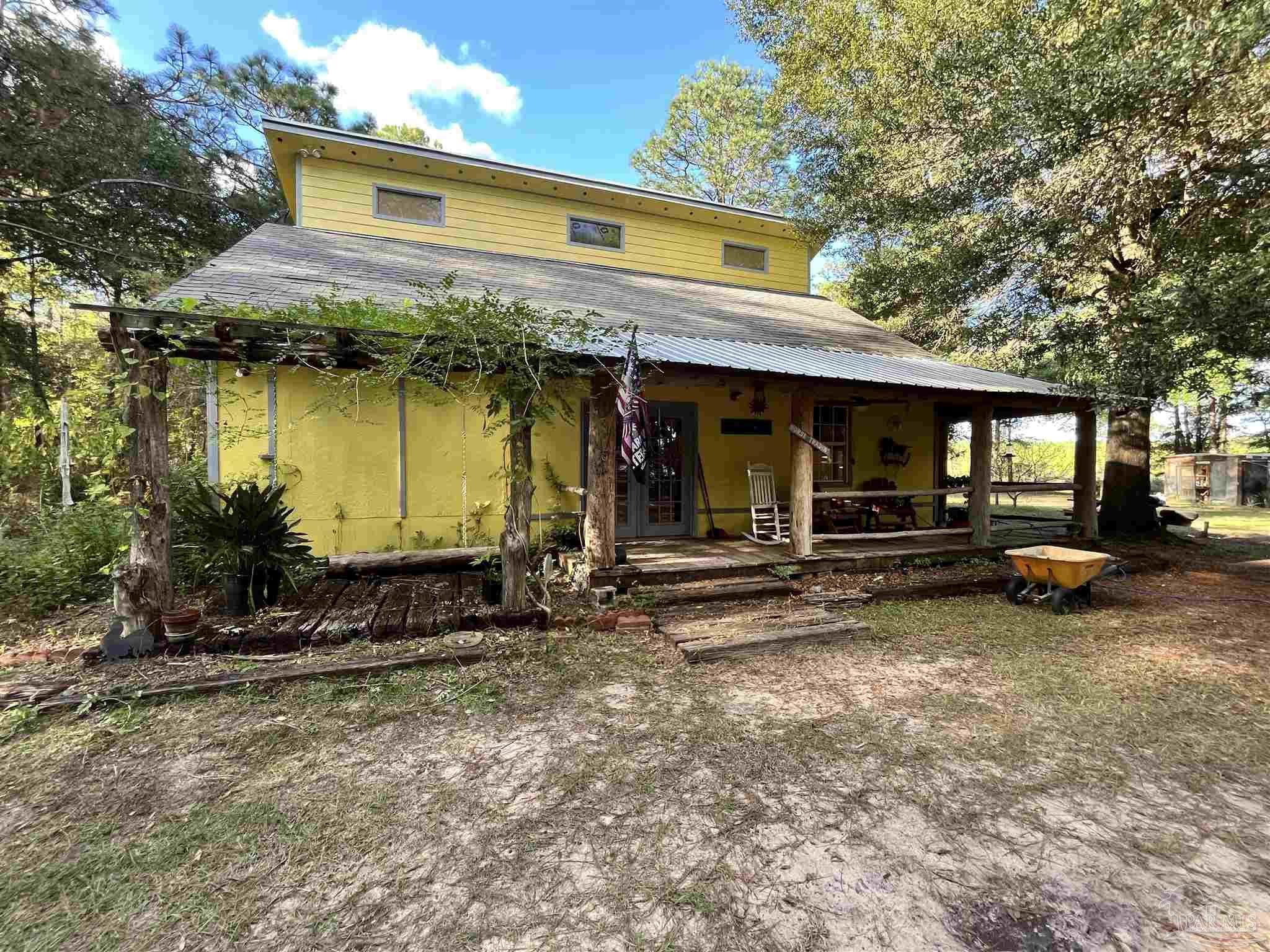 a front view of a house with garden