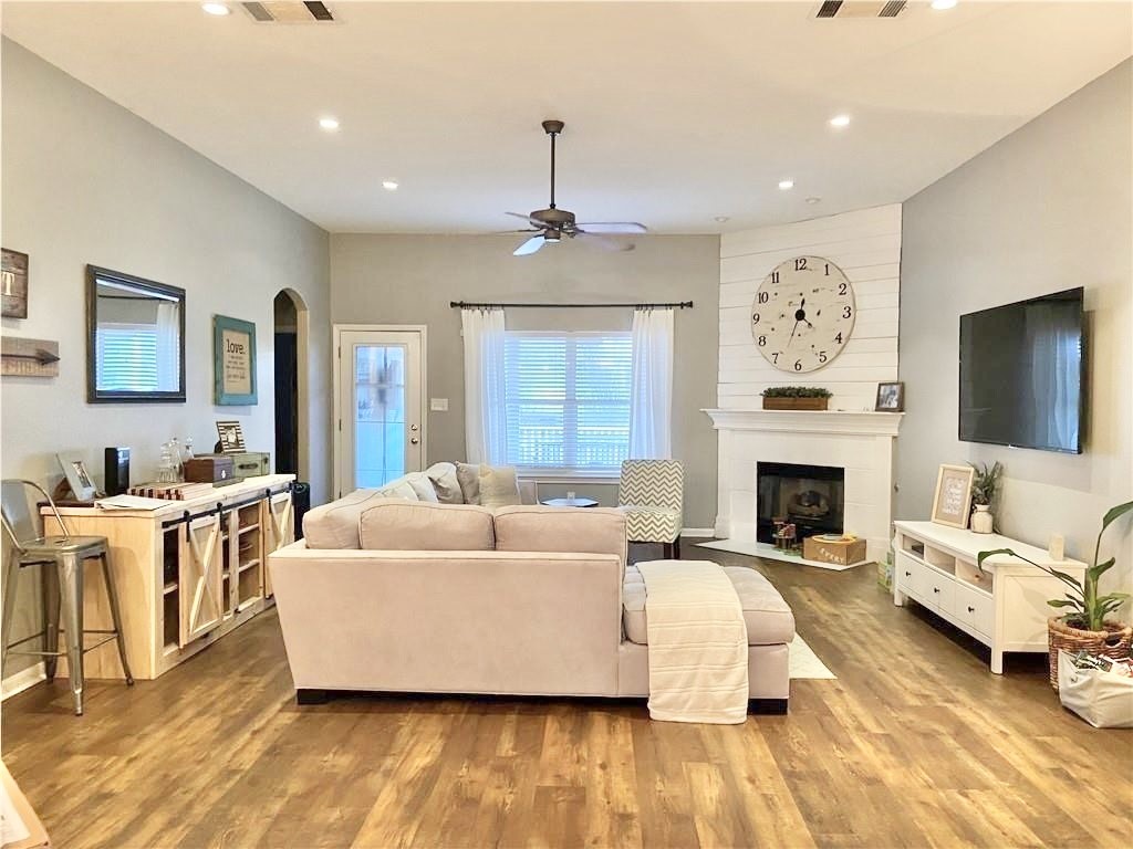 a living room with furniture and a fireplace