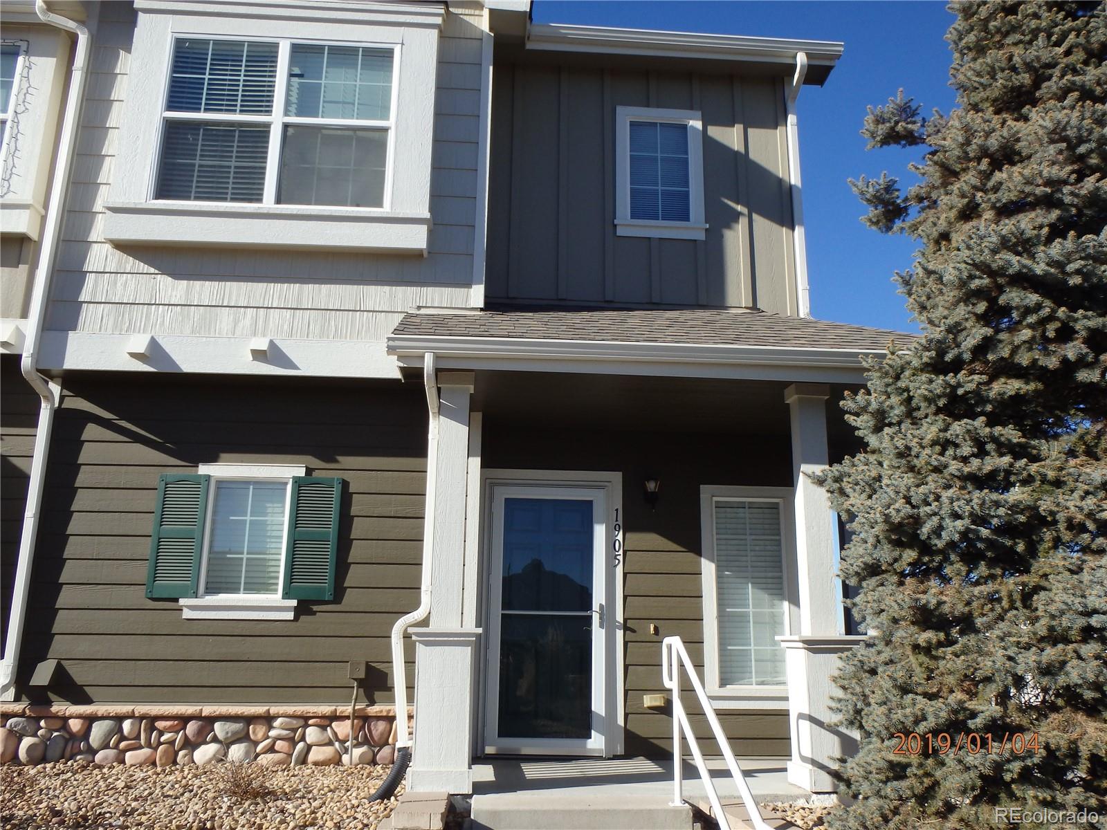 a front view of a house with a porch