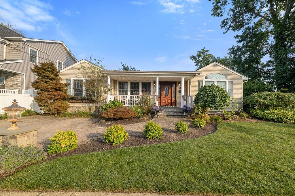 front view of a house with a yard