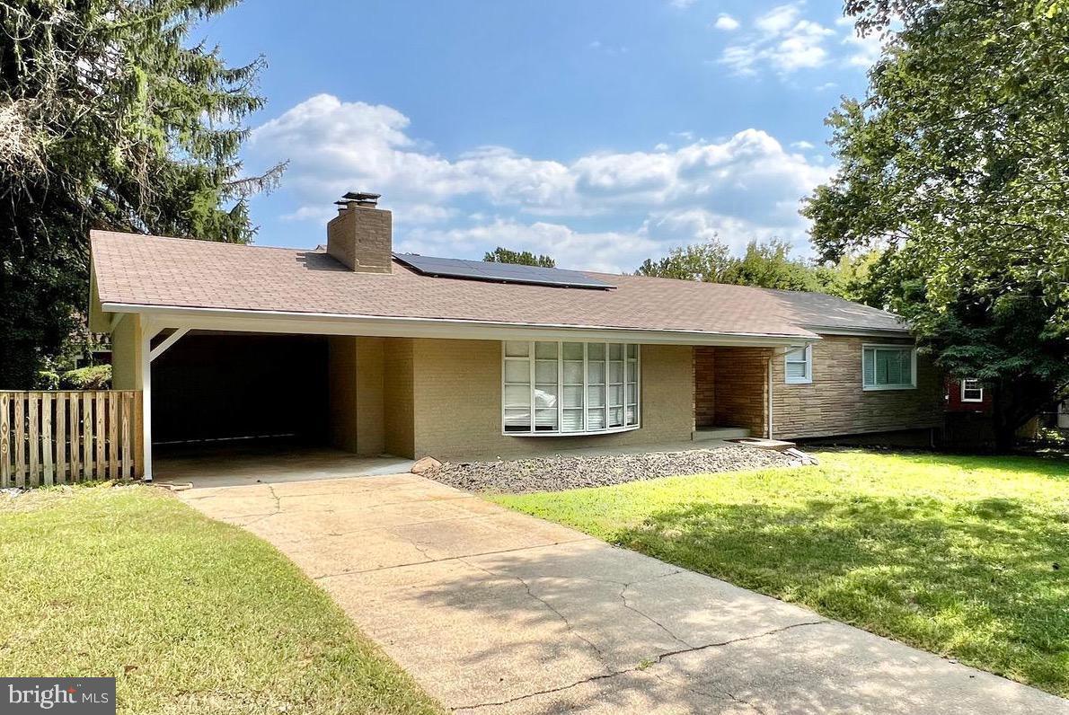 a front view of a house with yard and seating area