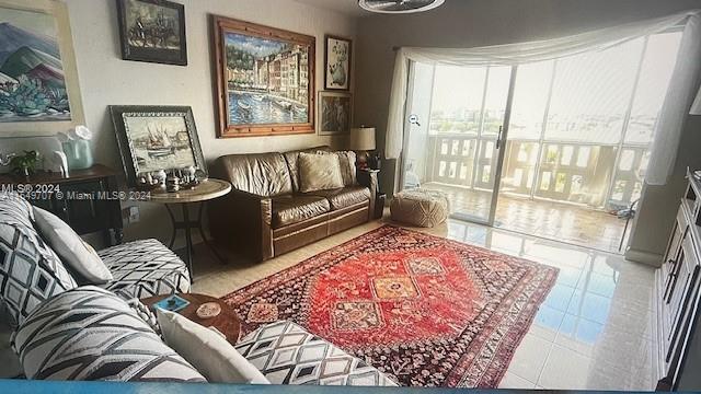 a living room with furniture and a rug