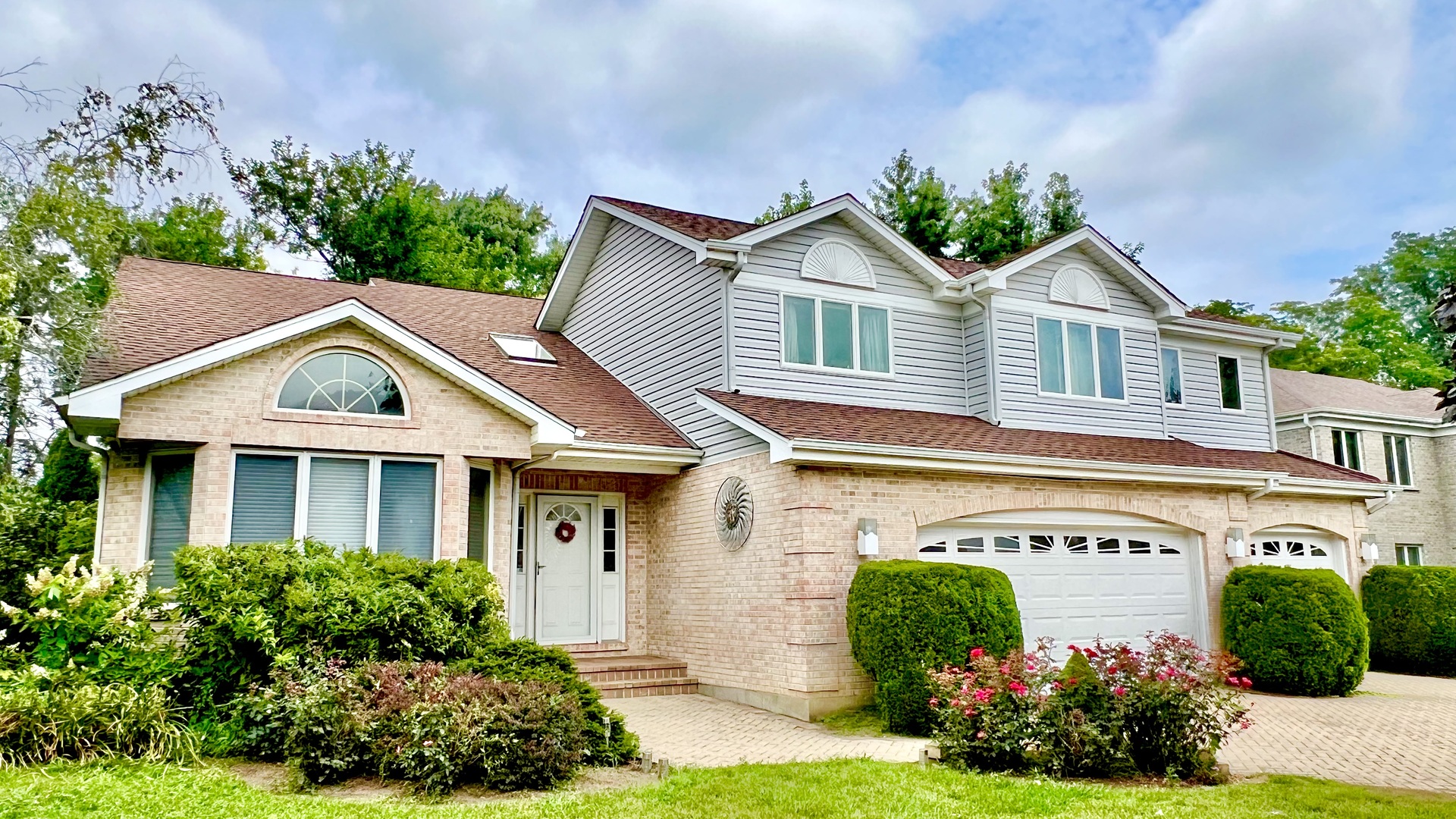 a front view of a house with garden