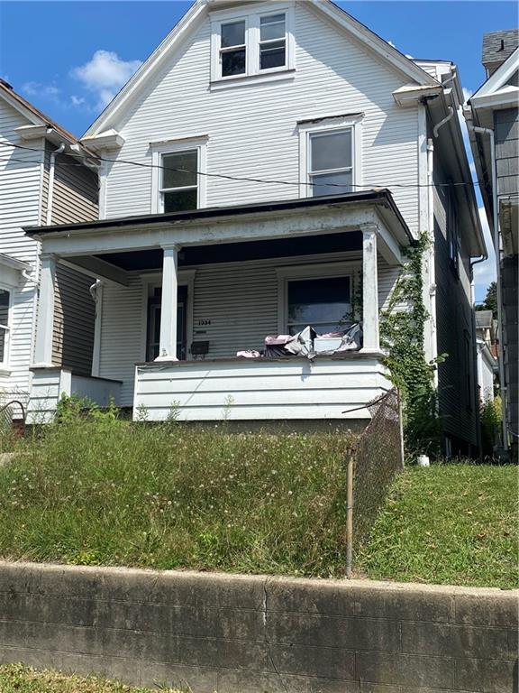 a front view of a house with garage