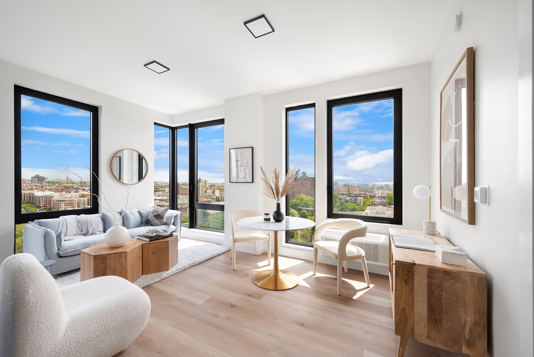 a living room with furniture and a floor to ceiling window