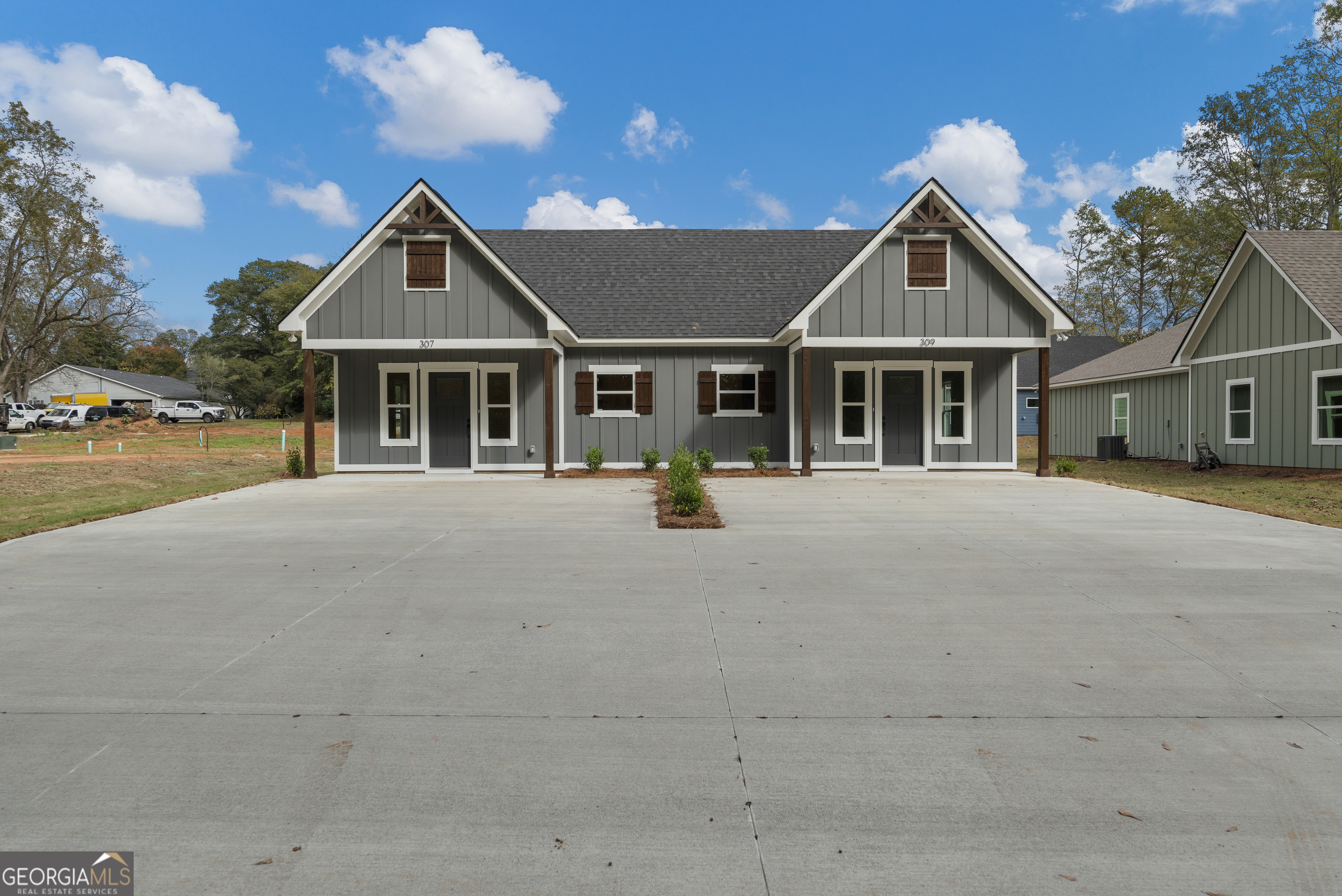 front view of a house with a yard