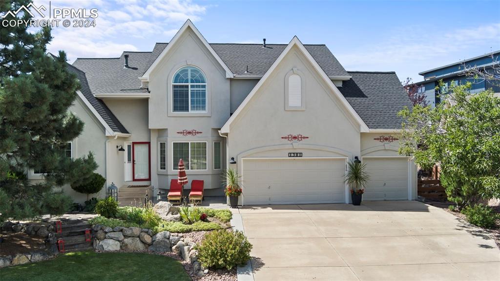 a view of house and yard with green space