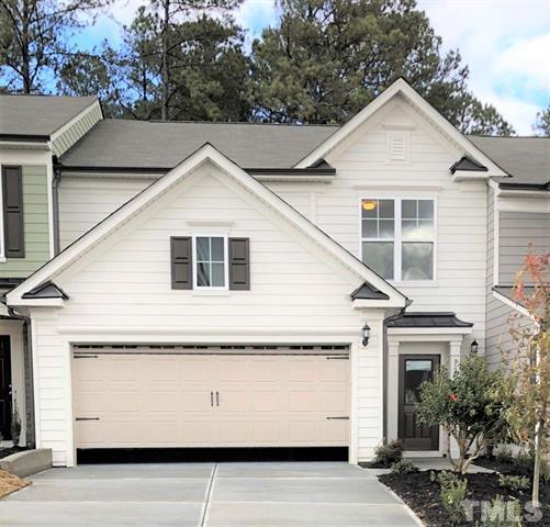 a front view of a house with a garage