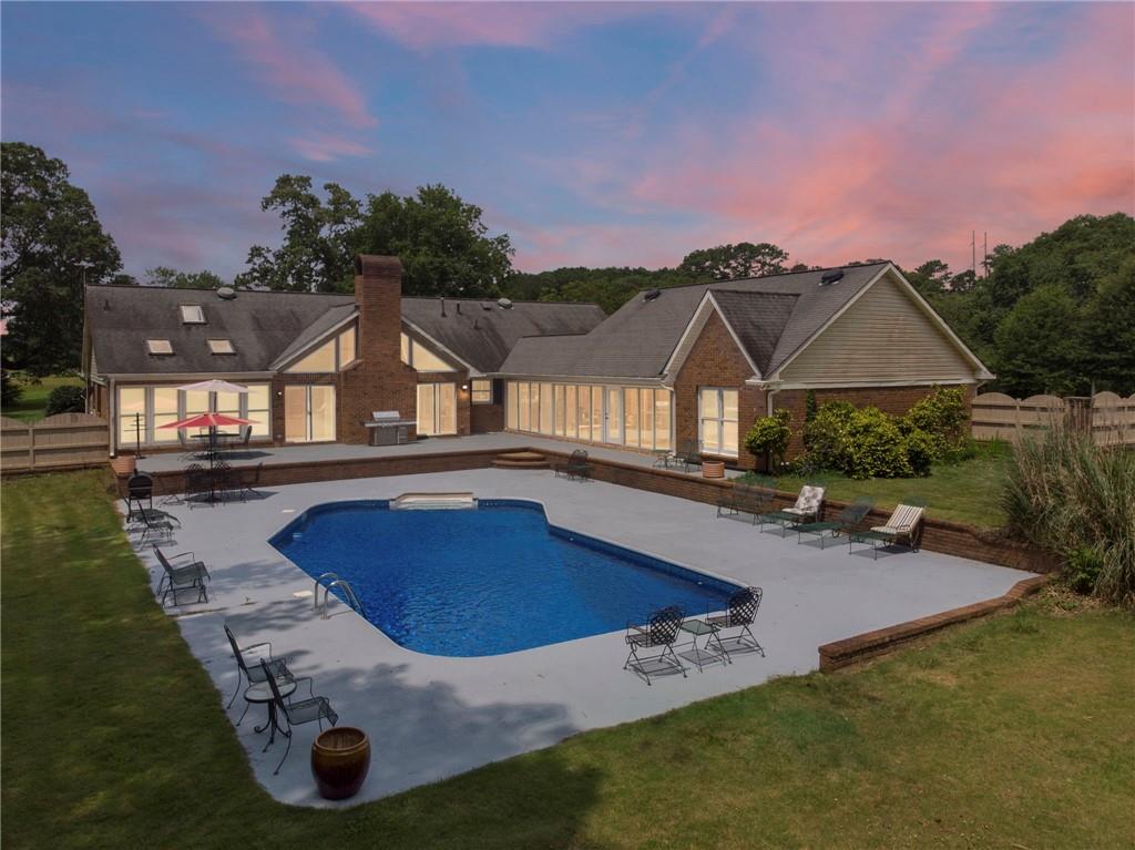 a view of a house with swimming pool