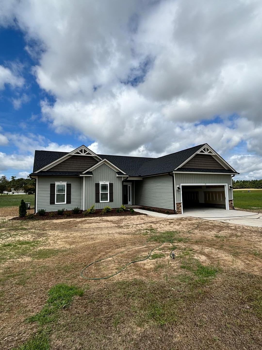 a front view of a house with yard