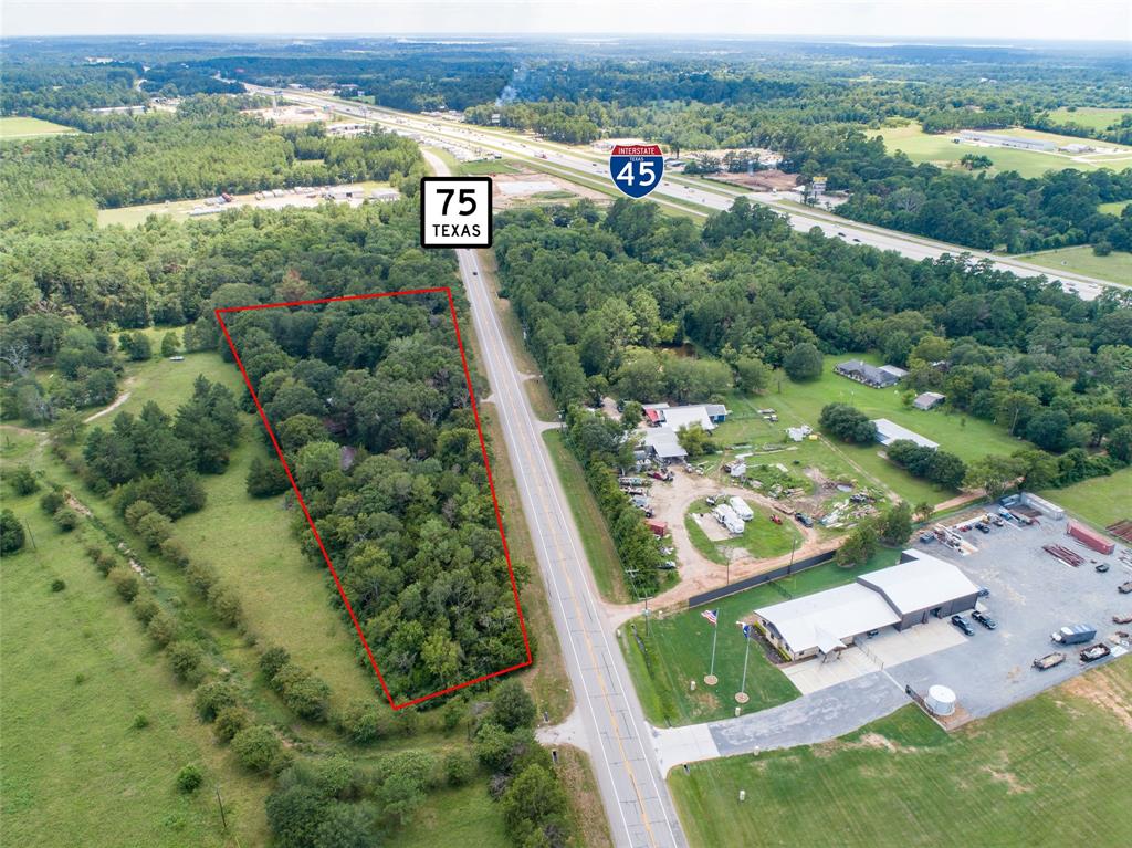 Explore the potential of 4.7 acres offering expansive 1000+ ft highway frontage on Hwy 75 with no restrictions – ideal for diverse development opportunities.