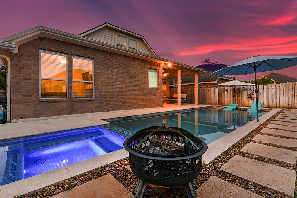 a view of a house with tub and chairs