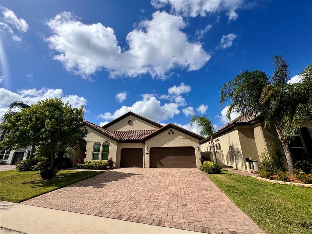 a front view of house with yard and green space