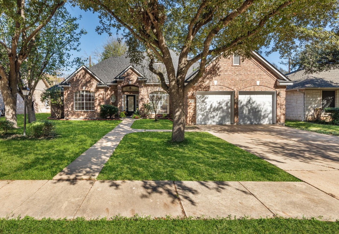 a front view of a house with a yard