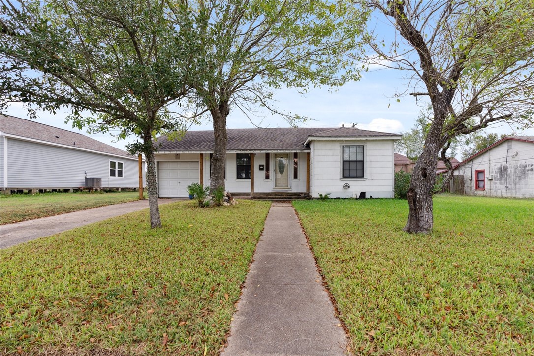 a front view of a house with a yard