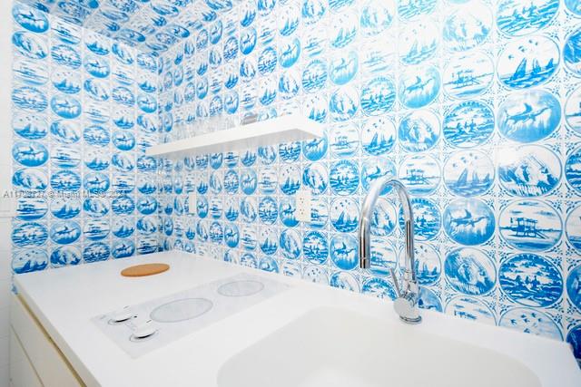 a bathroom with a sink toilet and shower curtain