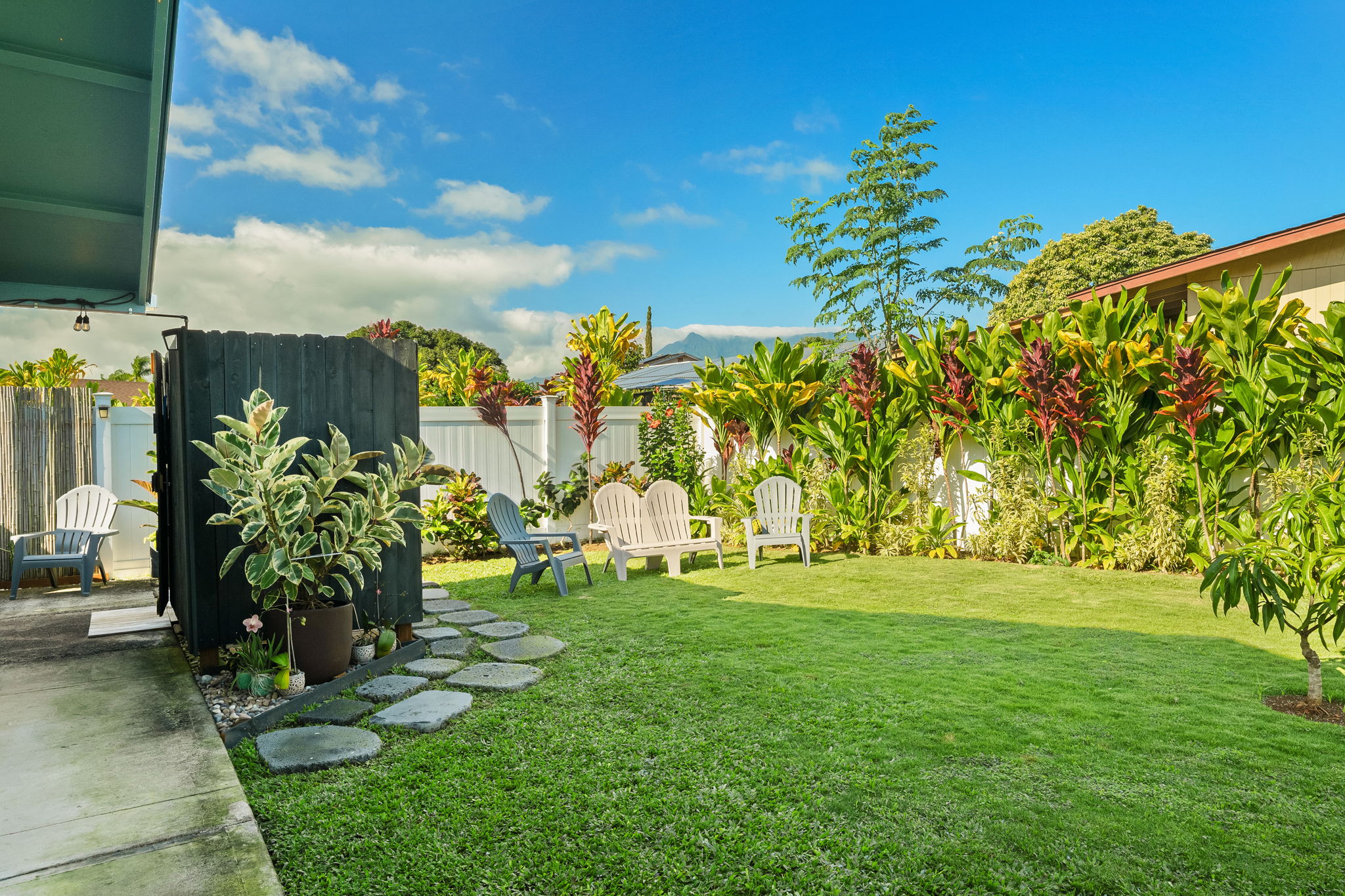 Peace and serenity at 5773 Kuamoo Road with its private enclosed yard which has been fully landscaped, along with a newly custom built outdoor shower with separate tankless hot water.