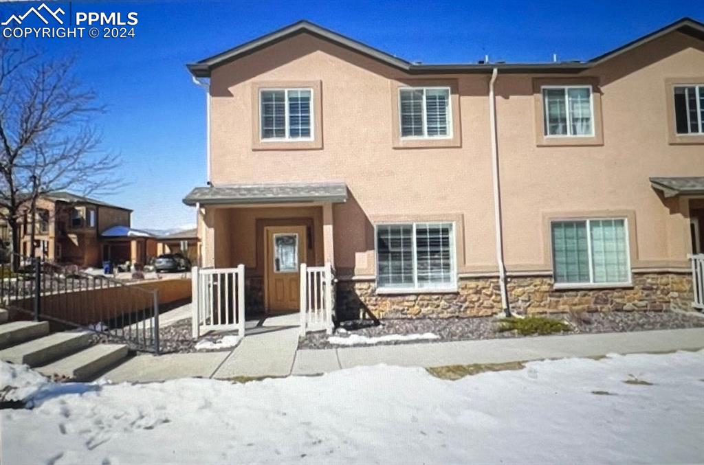 a front view of a house with a yard