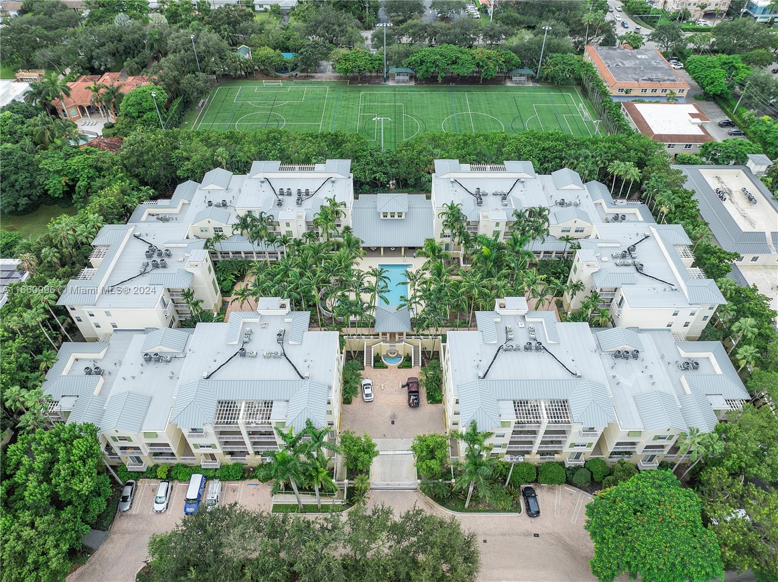 an aerial view of a house with outdoor space and street view