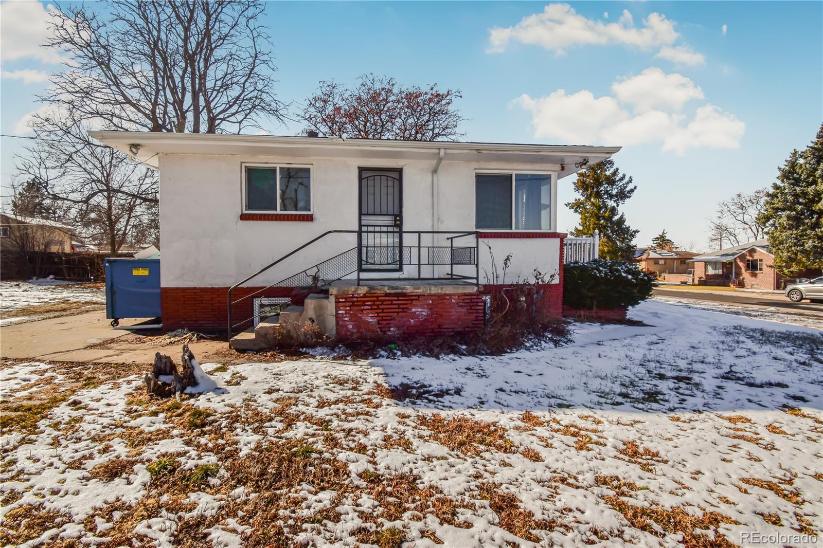 a view of a house with a yard and sitting area