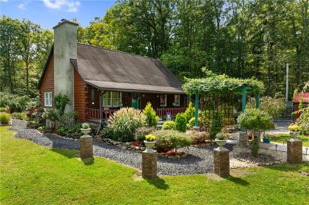 a front view of a house with garden