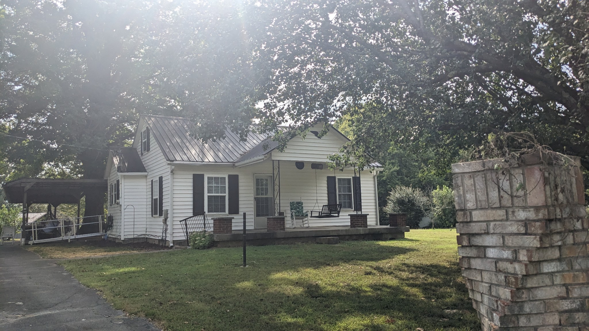 a front view of house with yard and outdoor seating