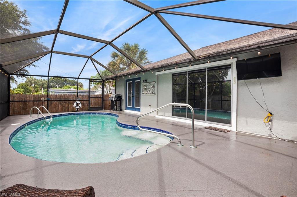 a view of a swimming pool with a lounge chairs