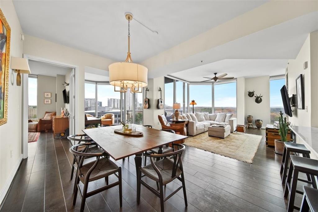 a living room with lots of furniture and a chandelier