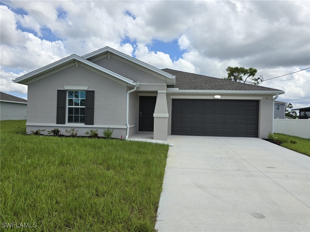 a front view of house with yard and green space