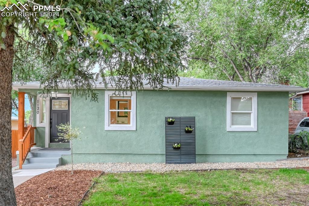 front view of a house with a yard