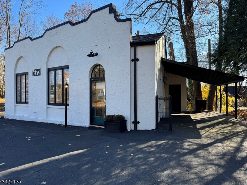 front view of a house with a view of a building