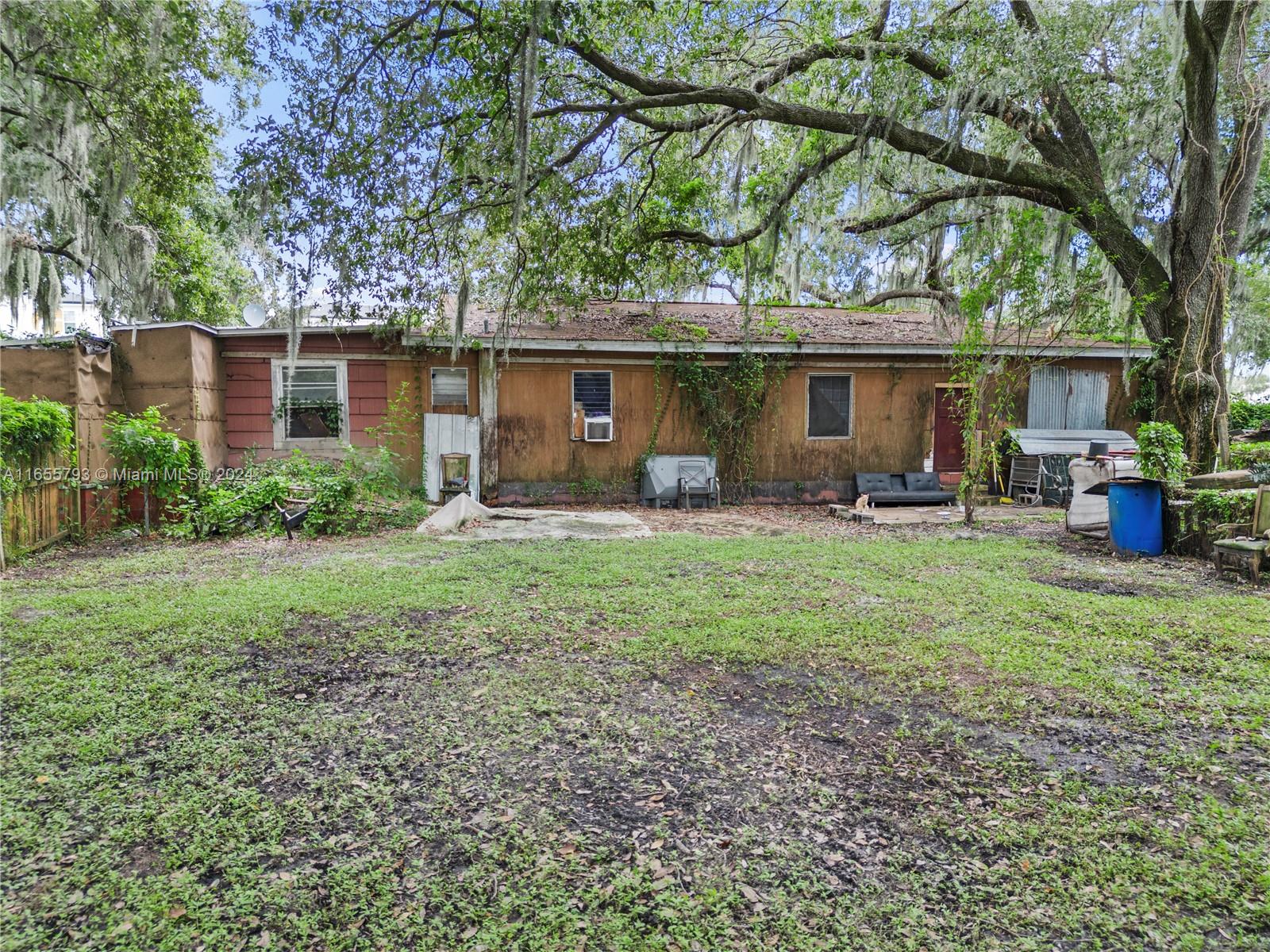 a front view of house with yard and outdoor seating