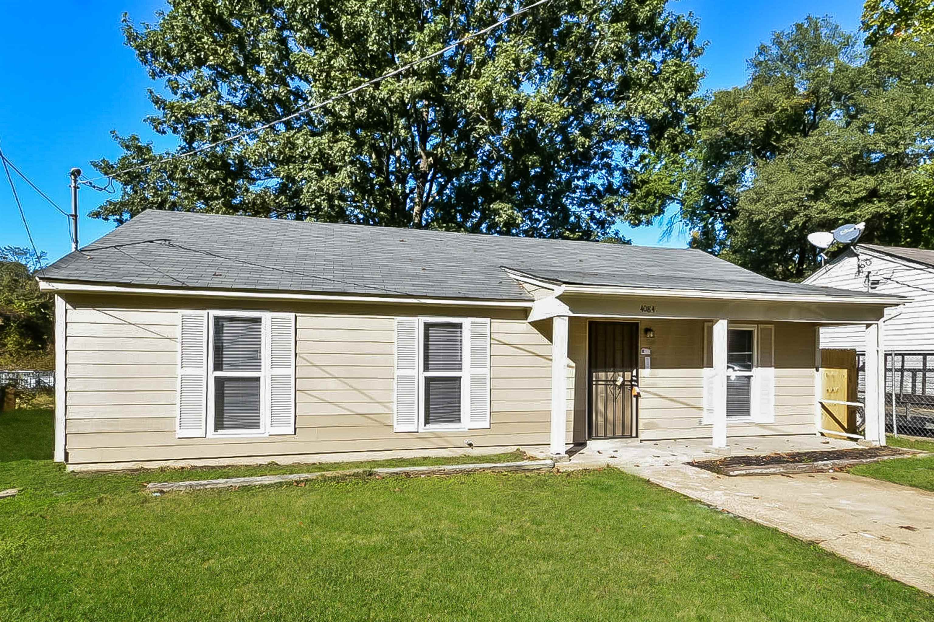 front view of a house with a yard