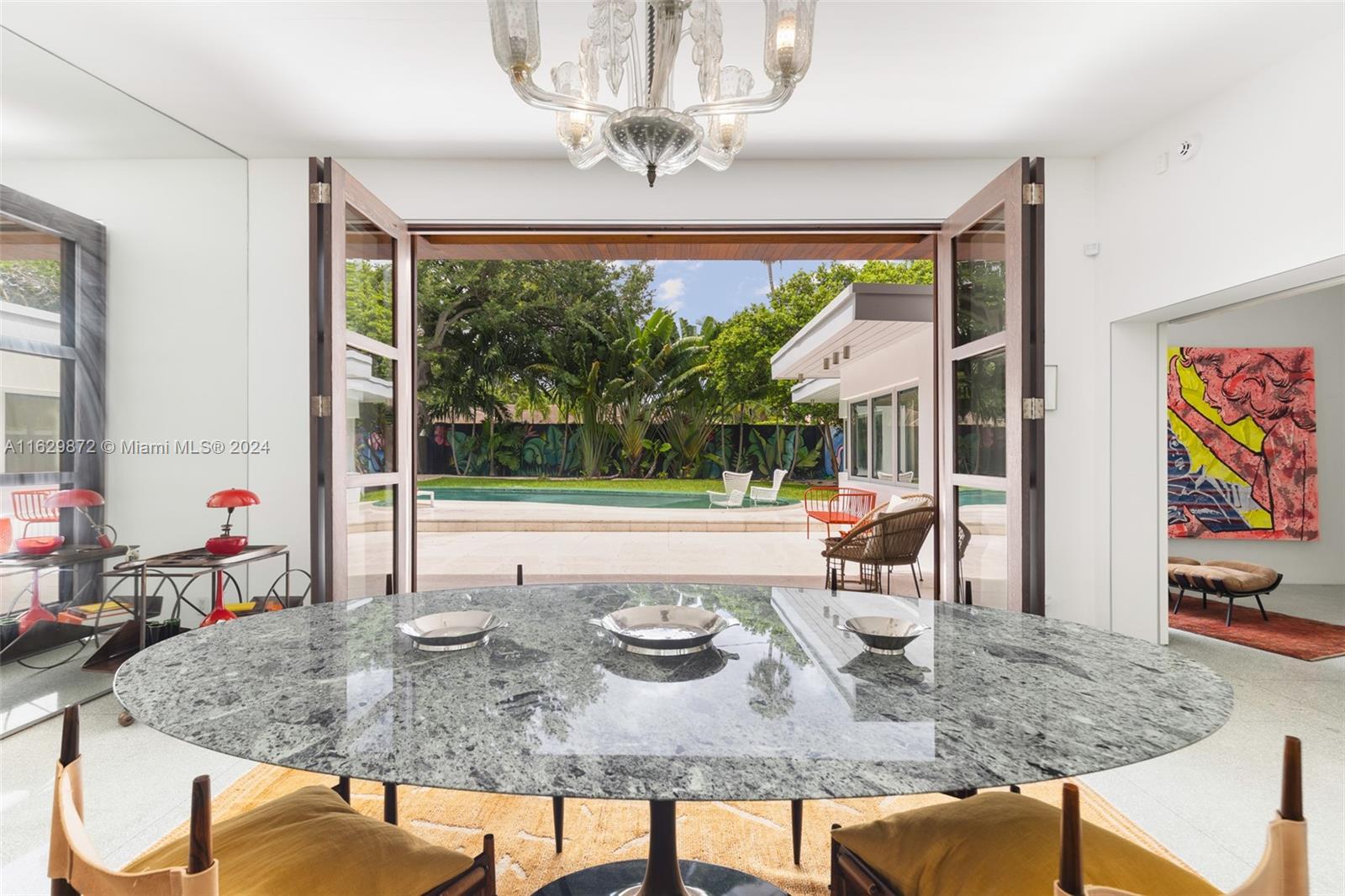 a dining table with the view of kitchen