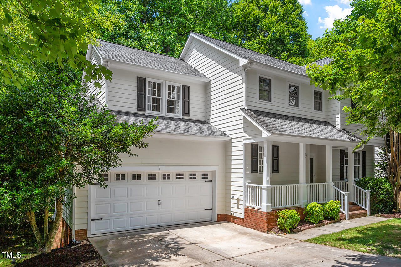 a front view of a house with a garage