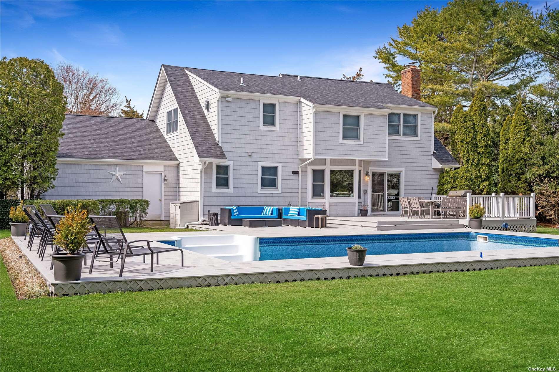 a house view with a sitting space and garden