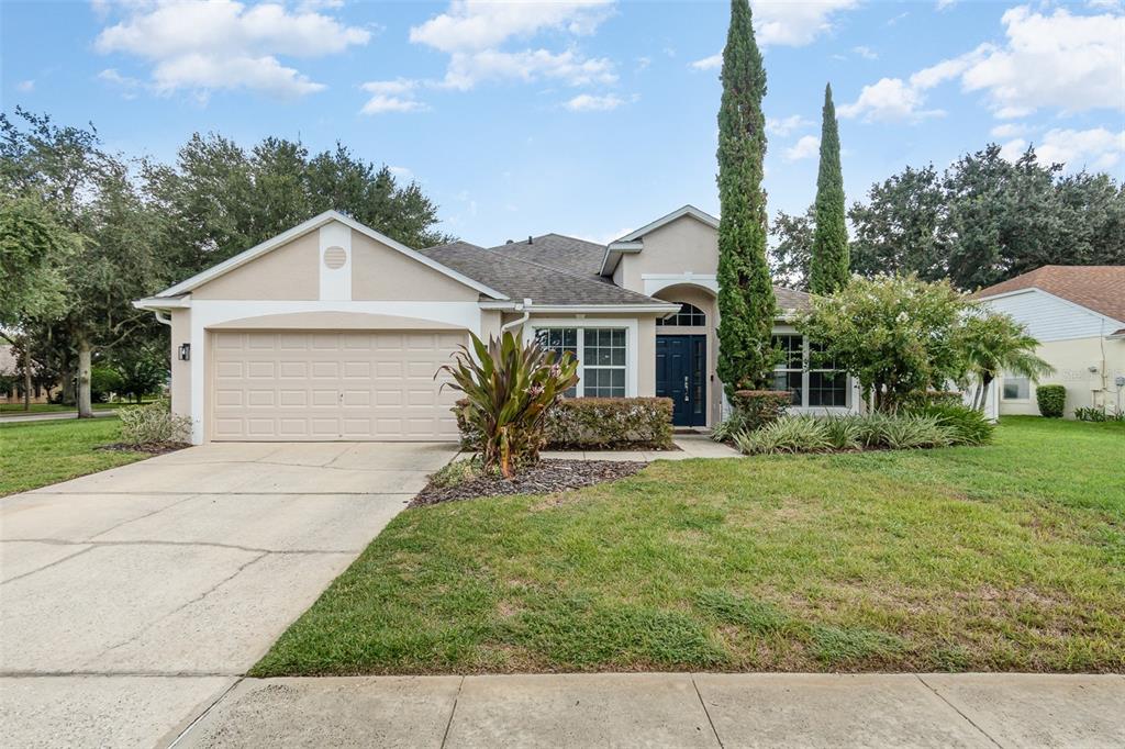 a front view of a house with a yard